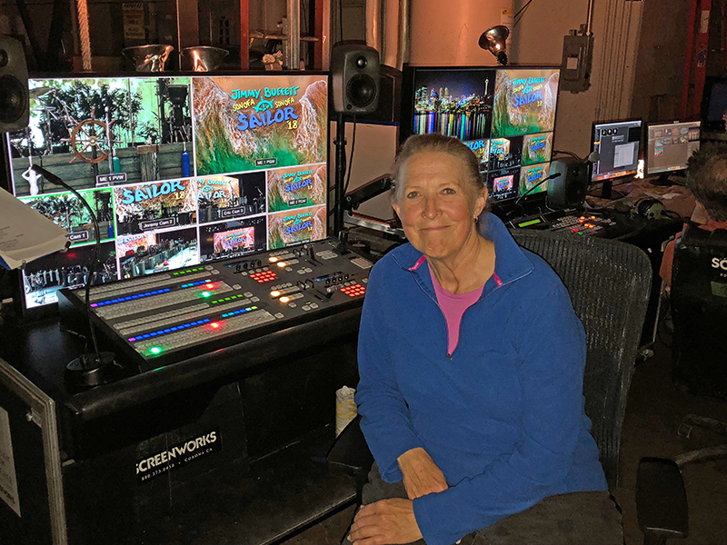 Dodds at the video controls on a 2018 Buffett tour
