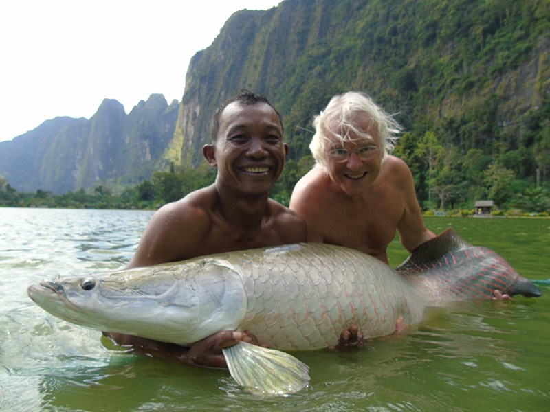 John catching an Amazon arapaima, one of the world's largest freshwater fish
